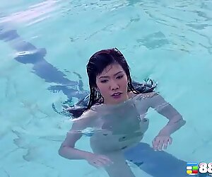 Naughty Japanese teen with sexy boobs makes a nice pose outside